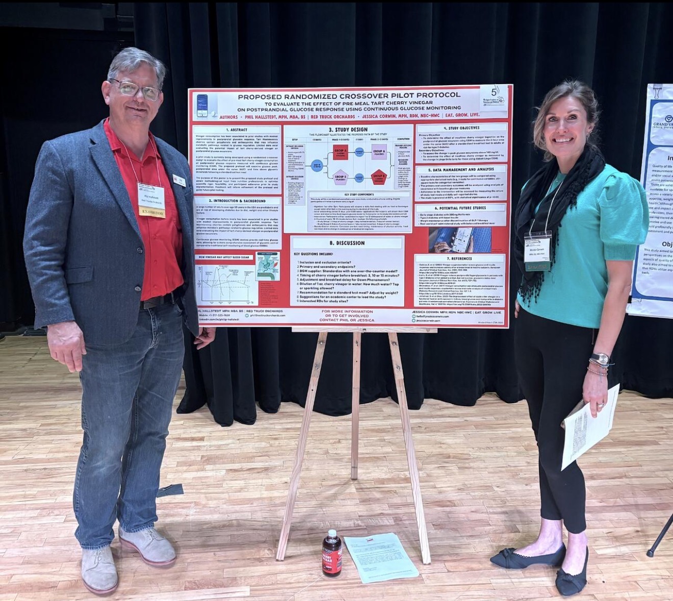 Jessica Corwin at a conference booth engaging with dietitians
