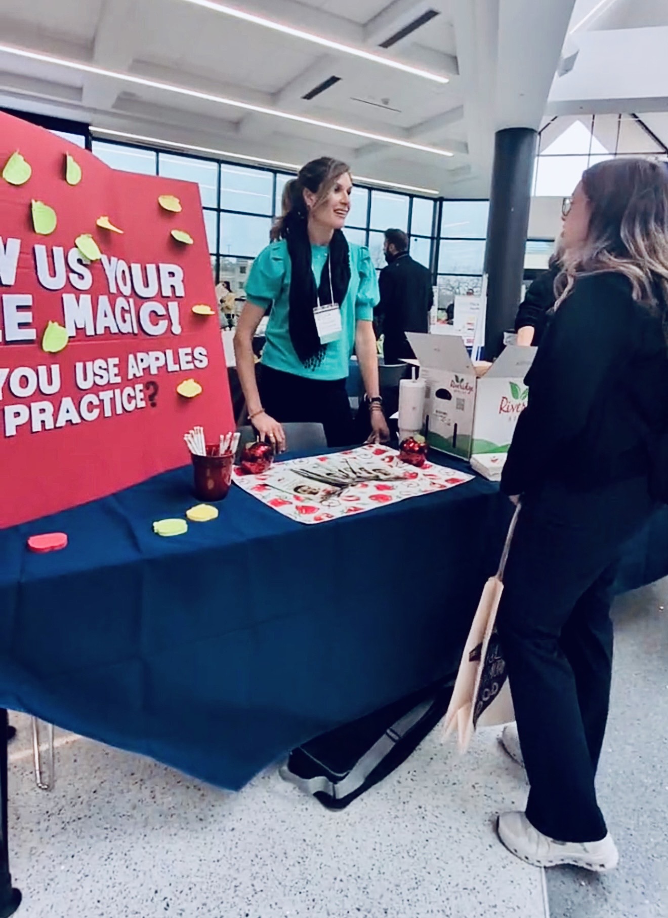 Jessica Corwin speaking on stage about estrogen and midlife health