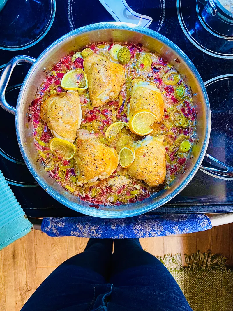 Cooking pot with fresh vegetables and herbs